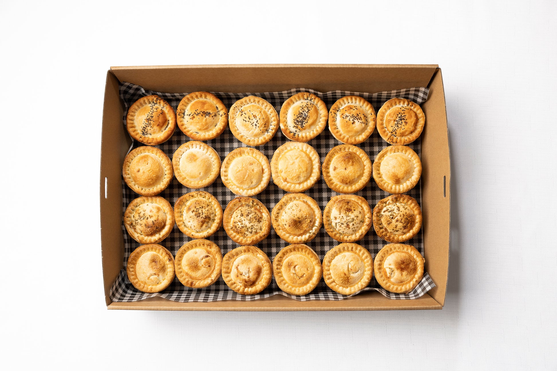 A box of 24 gourmet cocktail pies in a variety of flavours