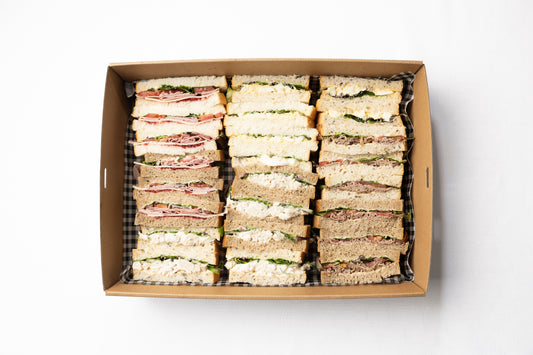 A box of freshly made finger sanwiches