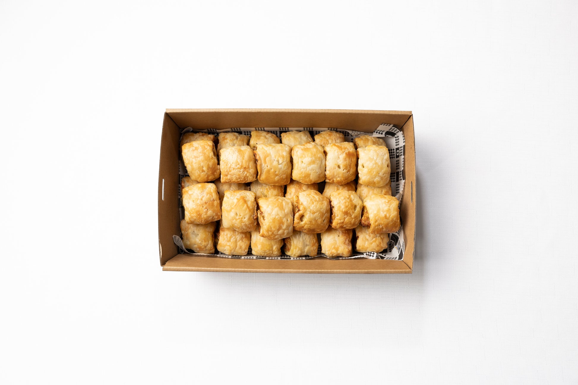 A box of 30 homemade cocktail sausage rolls