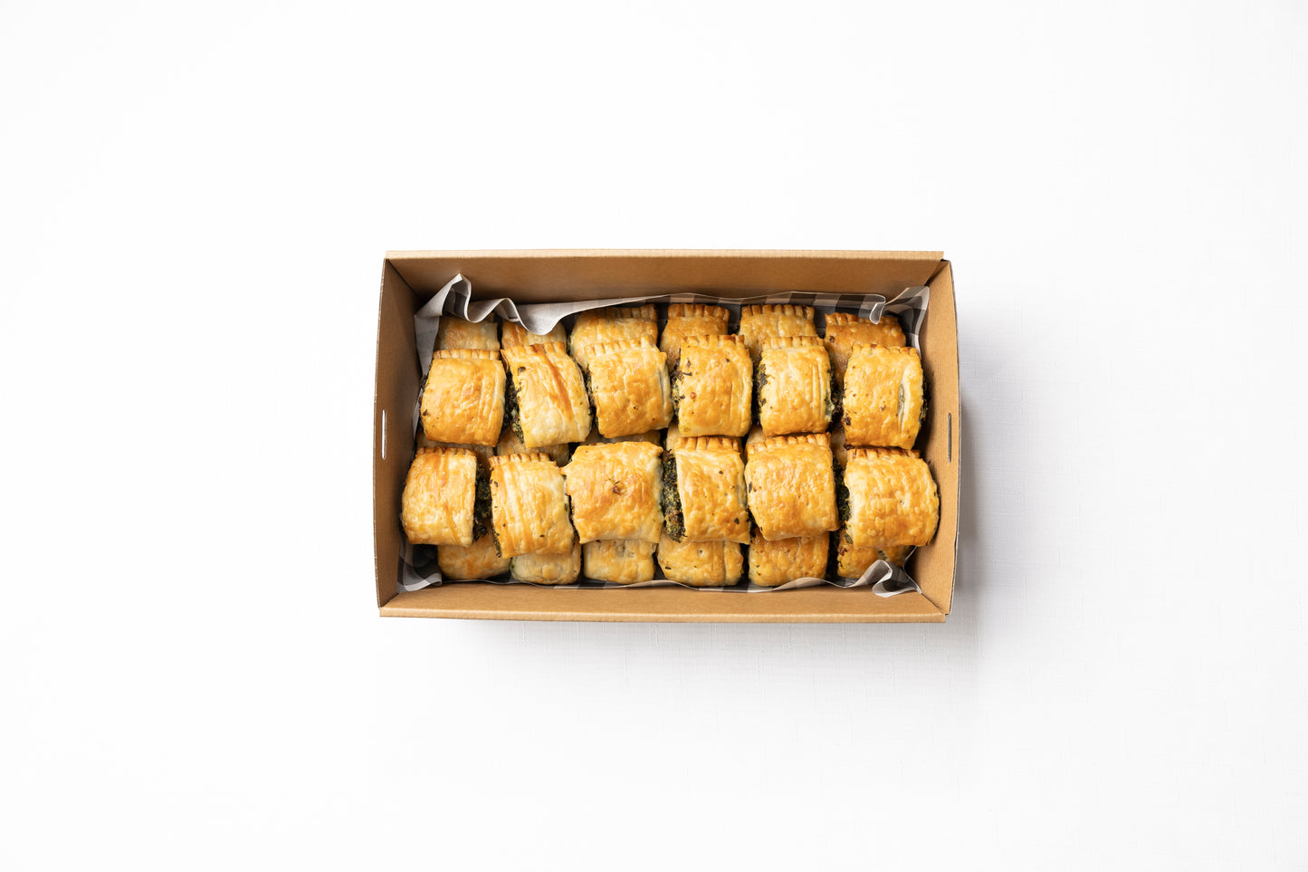 A box of 30 homemade cocktail spinach & feta rolls