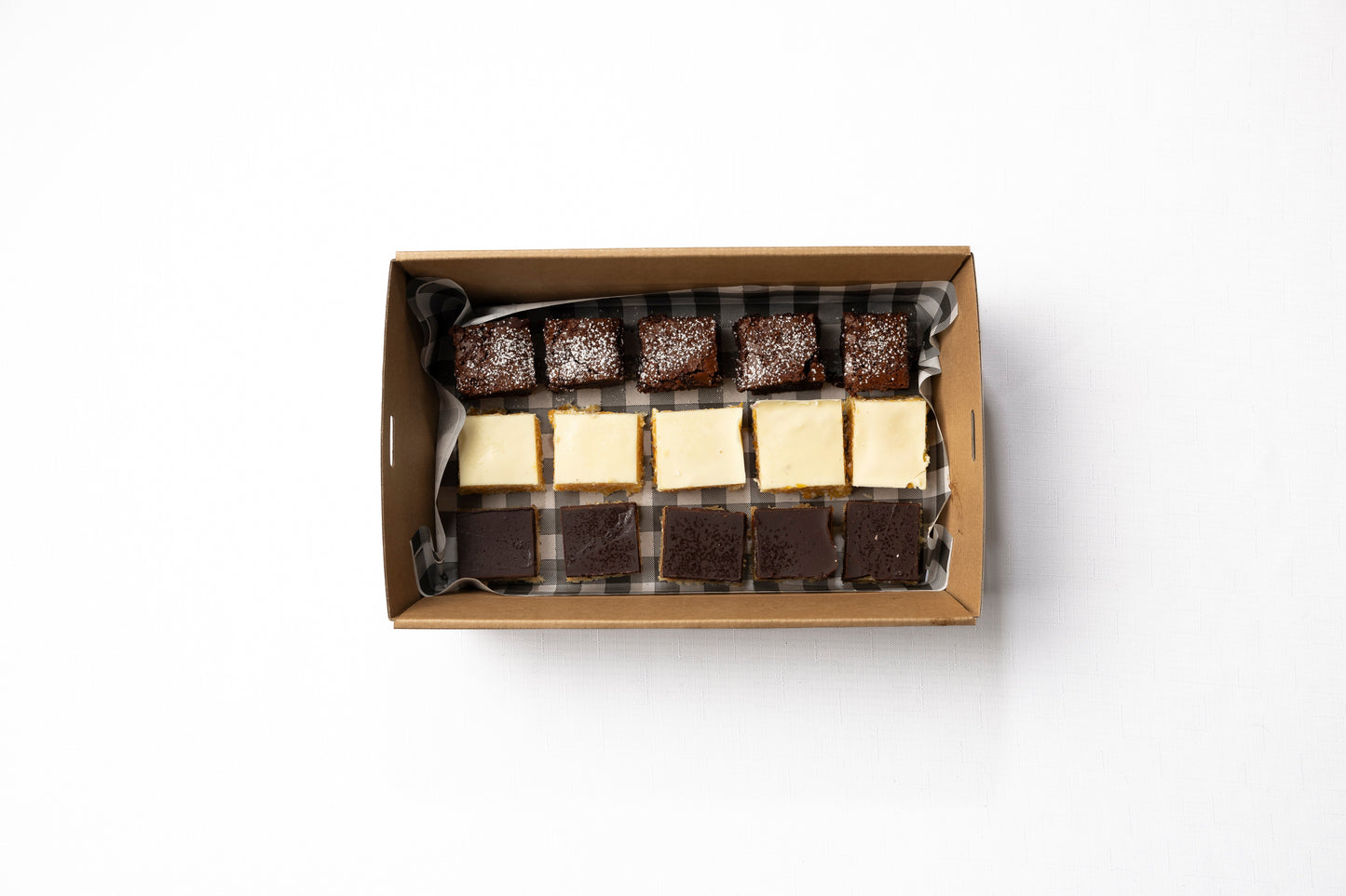 A box of 15 housemade slices: 5 chocolate brownie, 5 white chocolate & apricot slice, 5 x chocolate caramel slice