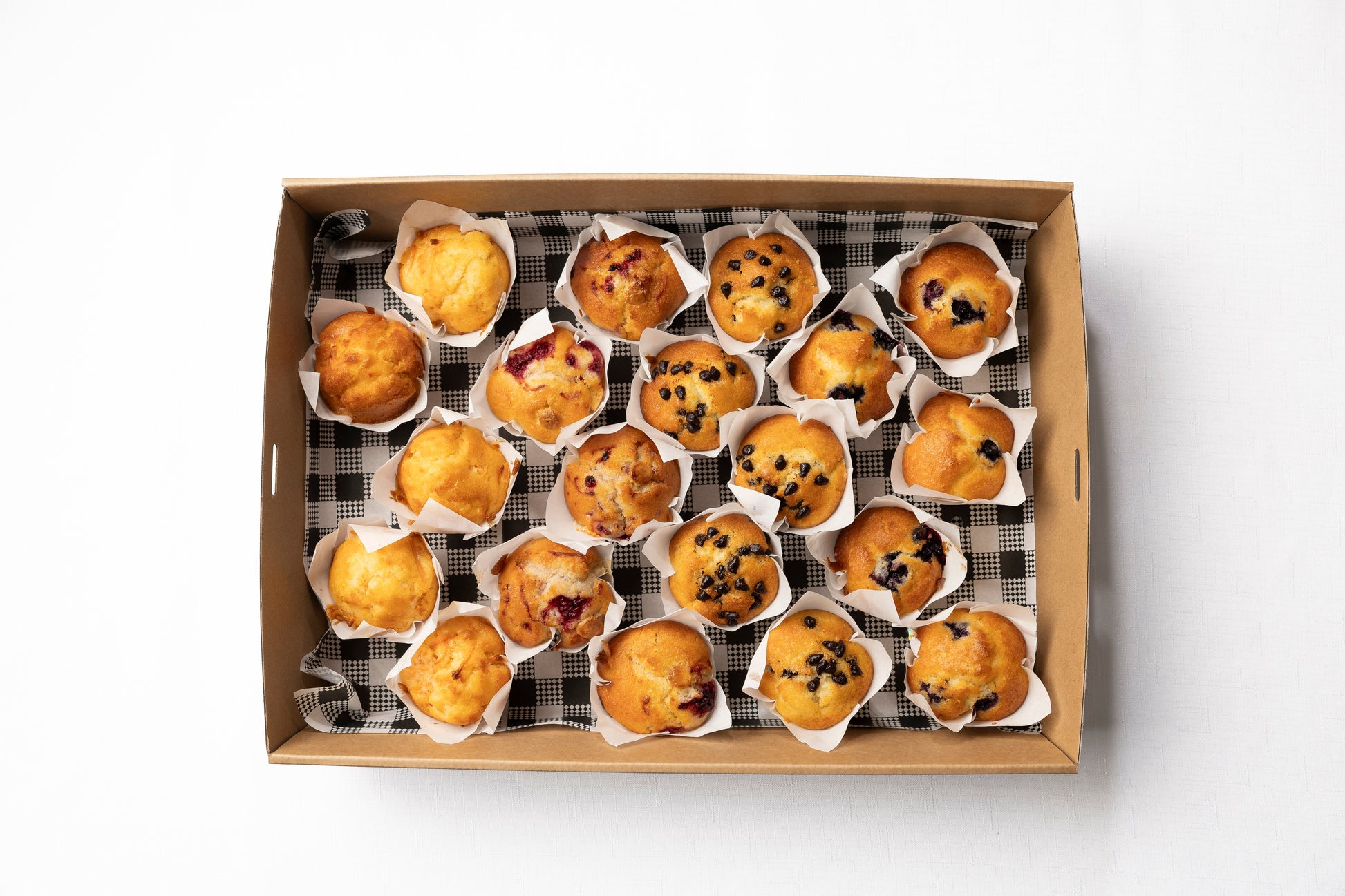 A box of freshly baked muffins